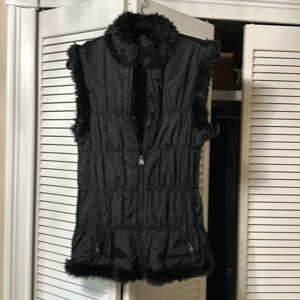 Reversible, puffy vest with fur lining. Sz L
